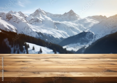 Empty wood wooden table top with blur background of Alpine with snow capped for display product