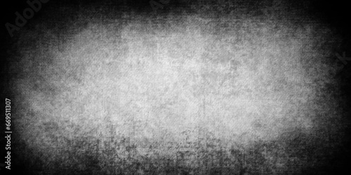 Abstract design with grunge black and white background . Old cement wall . scary dark texture of old paper parchment and .decorative plaster or concrete with vignette  paper texture design .Dark wall 