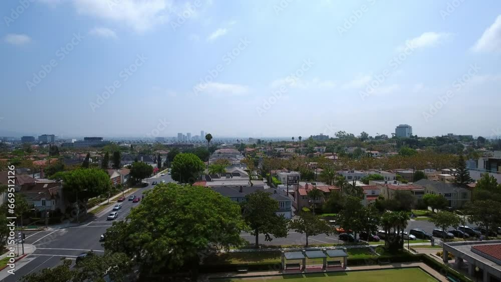 Aerial Shot Of Vehicles On Roads Amidst Houses In Suburb Against Sky - Beverly Hills, California