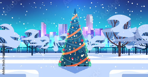 city park with decorated christmas tree and snowflakes in night sky happy new year winter holidays celebration concept
