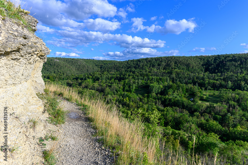 A hiking trail in the limestone slopes near the city of jena, thuringia, germany A hiking trail in the limestone slopes near the city of jena, thuringia, germany