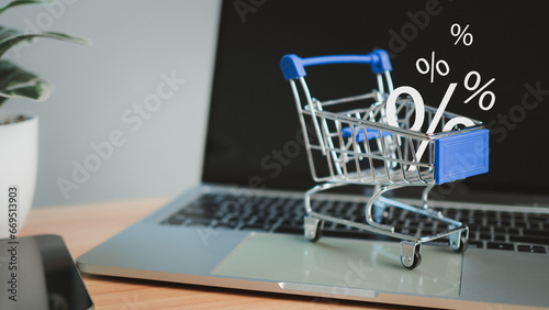 Sale percentage falling in shopping cart located on a computer keyboard, Online shopping concept Special price product, Specials and promotions