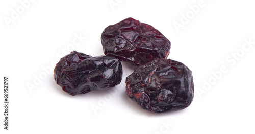 Dried black plums, prunes isolated on white background.