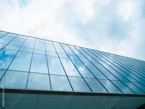 glass buildings with cloudy blue sky background, horizontal.