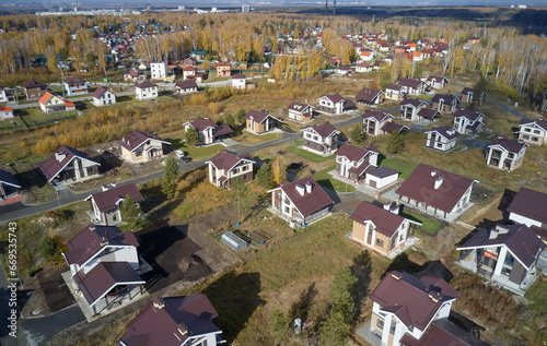 Aerial photo of scientific cottage village Sigma. Beautiful autumn country landscape from above. Novosibirsk, Siberia, Russia photo