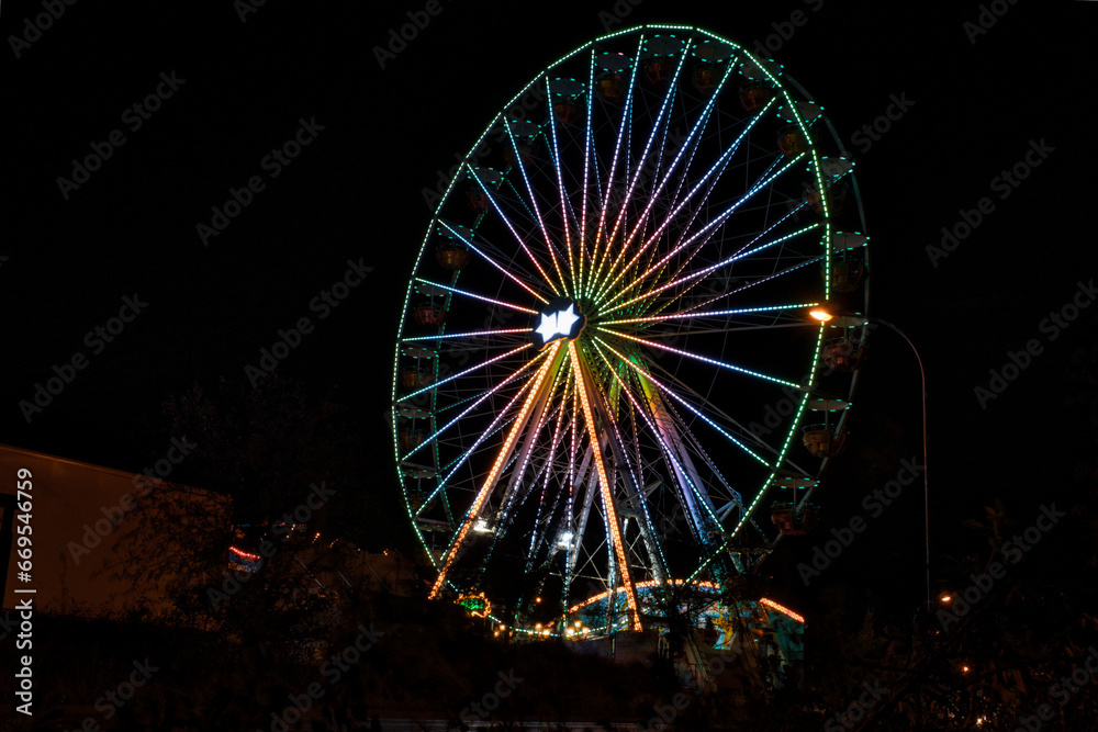 Rummel bei Nacht - Ferris wheel - Carousel - Attraction -  Rummelplatz - Jahrmarkt - Oktoberfest - Riesenrad - Night - Karussel - Background