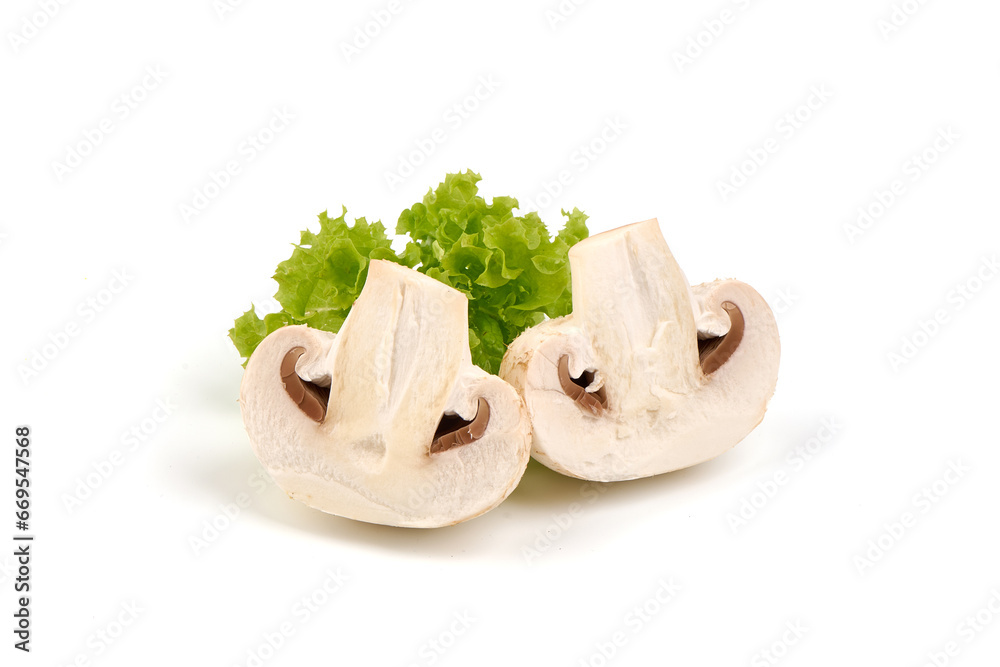 Fototapeta premium Champignons with lettuce leaf, close-up, isolated on white background.