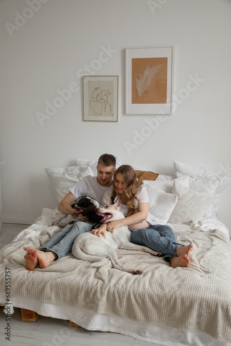 Couple in love, pregnant girl and guy with dogs, bright photo © Stanislava