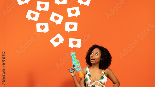 Curious woman with water gun, heart speech bubbles on orange background, panorama