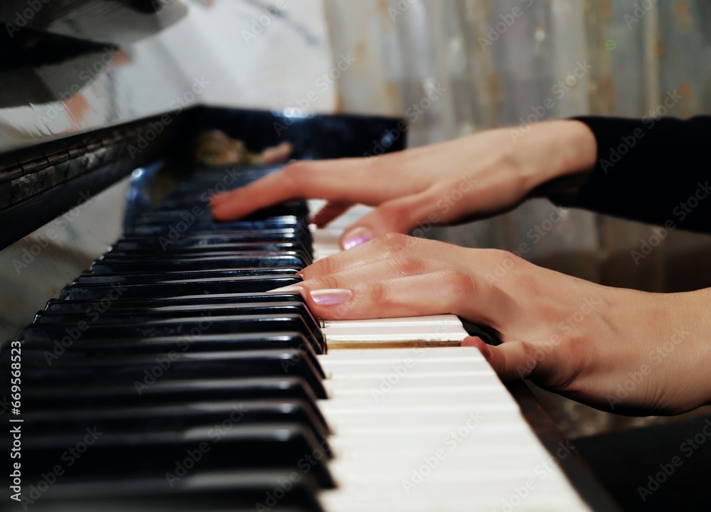 Fototapeta premium Hands playing piano