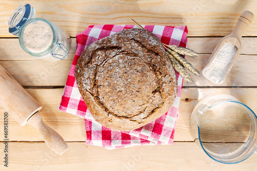 Starter sourdough ( fermented mixture of water and flour to use as leaven for bread baking). The concept of a healthy diet photo