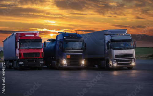 Fototapeta Naklejka Na Ścianę i Meble -  Trucks at sunrise in parking lot