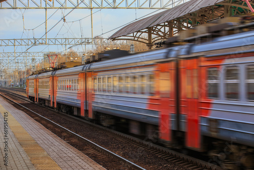 Electric train moves along the platform