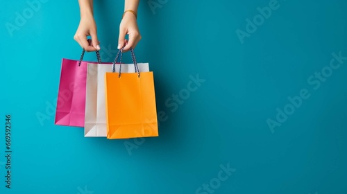 a woman holding shopping bags isolated on a blue background. generative ai