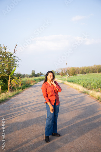 women asian standing on the countryside road