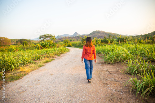women asian standing on the countryside road