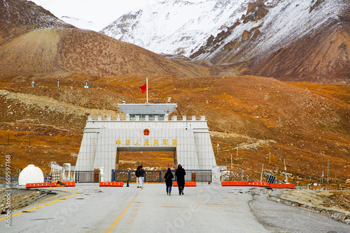 Khunjerab pass, Pakistan-China border and walking people. photo
