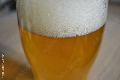 mug of beer light beer in a glass with beer foam