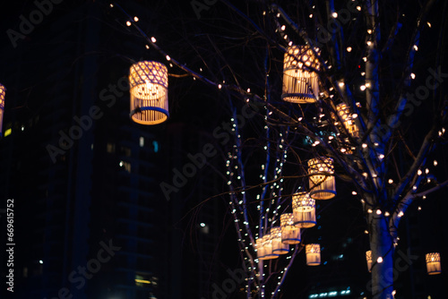 Blurred holiday background with bokeh. Defocused New Year and Christmas illumination