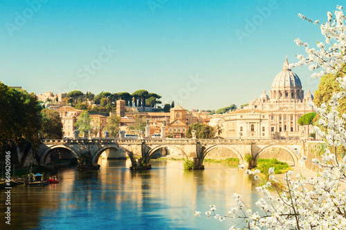 St. Peter's cathedral over bridge and river in Rome at spring, Italy