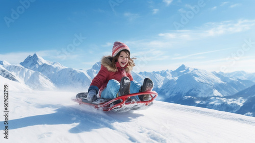 copy space, stockphoto, Happy girl sledding outdoors on clear winter day in the alps. Winter activity in the alps, little girl sledding during winter time. Alpine sports. Cute girl playing in the snow