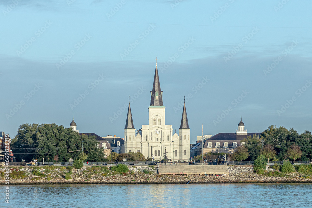St. Louis Cathedral, is the seat of the Roman Catholic Archdiocese of New Orleans, seen from river Mississippi in early morning light