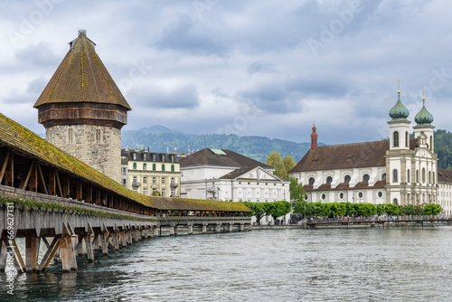 Famous Chapel Bridge crossing Reuss River in the historic center of Lucerne in Switzerland