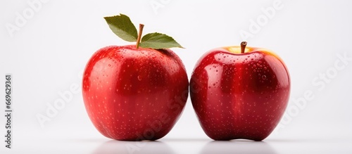 single red apple on a clear white surface