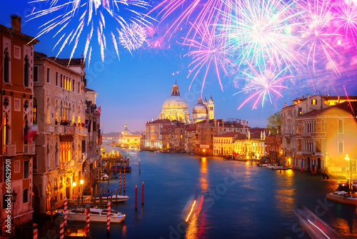 Grand canal and Basilica Santa Maria della Salute at night with fireworks, Venice, Italy