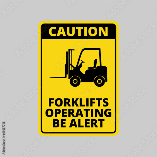 Caution sign, forklifts operating, be alert, on yellow background and black text