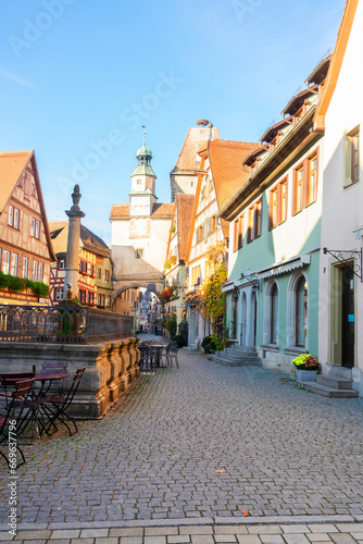 Marcus Tower with fountain and Roderbogen arch  street in Rothenburg ob der Tauber  Germany