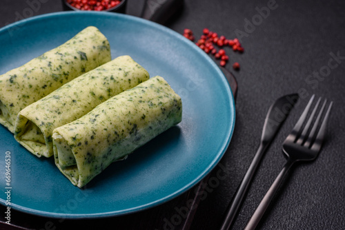 Delicious fresh pancakes with spinach  cream cheese  salmon  salt and spices