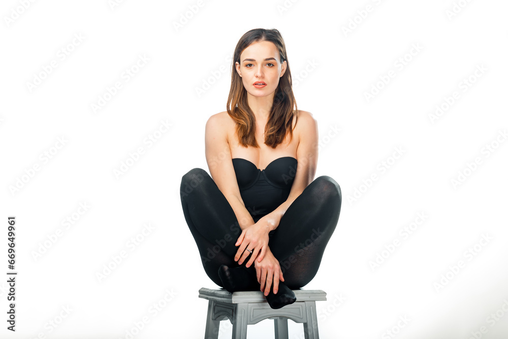 A Serene Woman Resting on a Stool in Peaceful Solitude