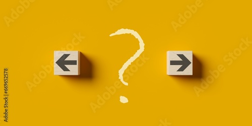 Left and right arrows on wood cubes with question mark in the middle, abstract decision or direction business strategy concept, flat lay top view from above on yellow background photo