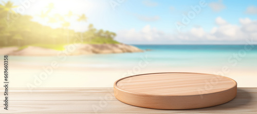 Wooden round podium on wooden table over tropical beach background.