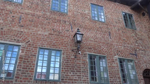 Odense, Denmark The facade of a classic house in a courtyard in Oluf Bagers Gaard.  photo