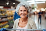 A happy, beautiful senior woman shopping for organic groceries at a supermarket, radiating cheerfulness and contentment.