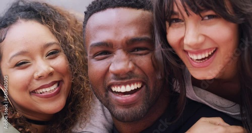 Face, funny and friends together outdoor, happy or bonding, hug or care. Portrait, smile and group of people laughing at comedy, joke and humor, embrace to support or diversity of black man and women photo