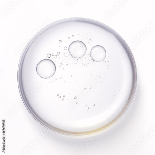 Moisturizing, bubbly glycerin liquid gel dropping onto a white surface. photo