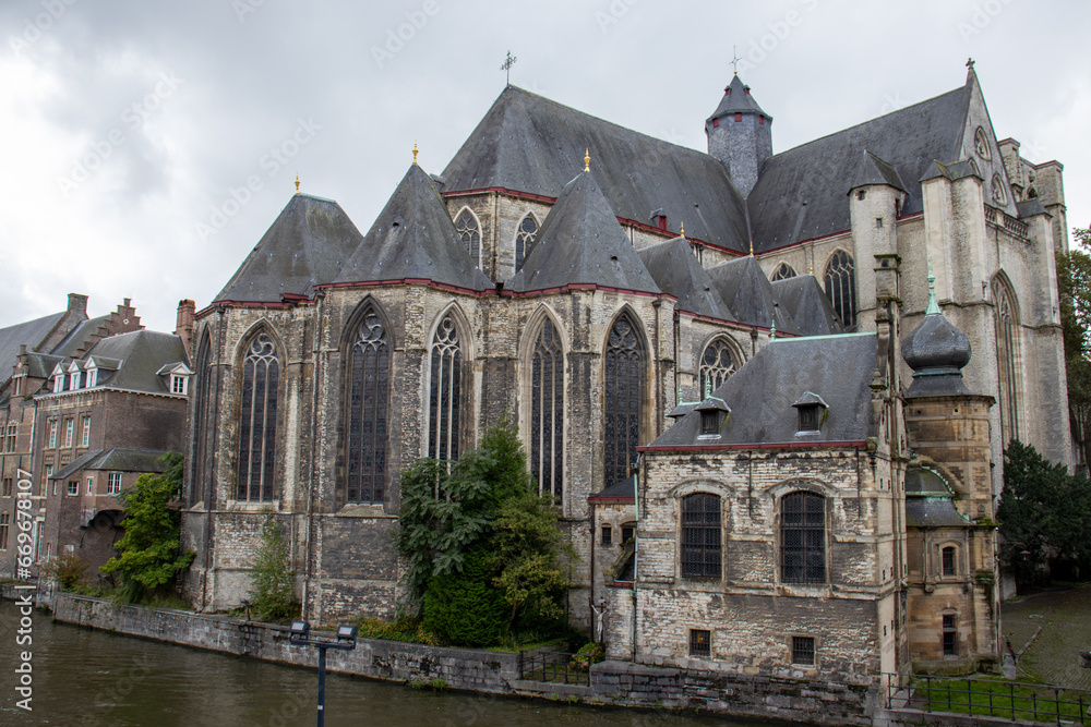 Saint Michael's Church in Ghent, a masterpiece of Gothic architecture, stands tall with its stunning spire
