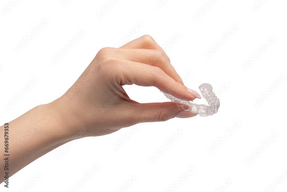 Transparent mouth guard in a woman's hand isolated. Transparent mouth guard in a woman's hand isolated.