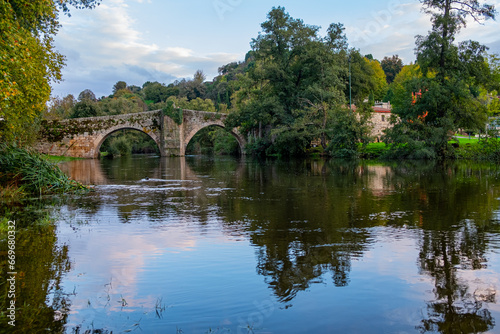 Medieval stone bridge over the Arnoia river in the town of Allariz. Province of Ourense. Galicia, Spain