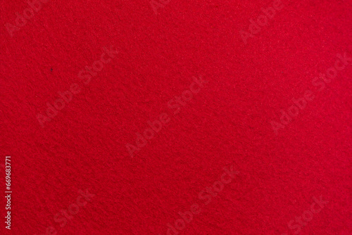Sponge texture background. Close-up of red bath sponge with porous structure for background. Macro photo.