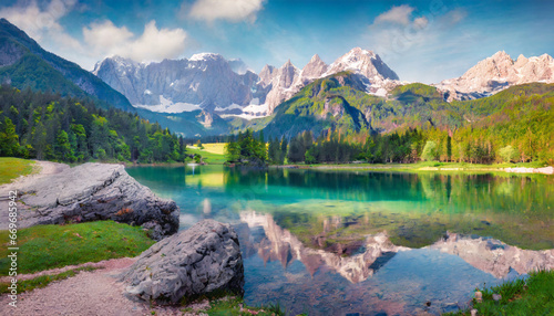 colorful summer view of fusine lake bright morning scene of julian alps with mangart peak on background province of udine italy europe traveling concept background