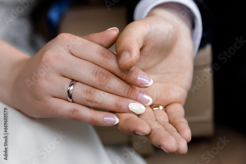 Close-Up of Couple s Hands with Wedding Bands