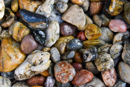 Colorful pebble rocks on the ground 
