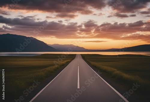 The empty road leading to the lake by sunset adventure-themed landscape vistas