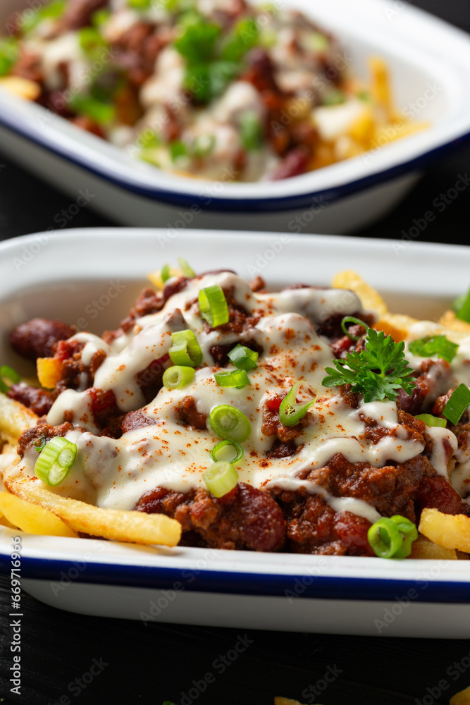 Chili Cheese Potato Fries topped with hot minced beef and cheese sauce Chili Cheese Potato Fries topped with hot minced beef and cheese sauce