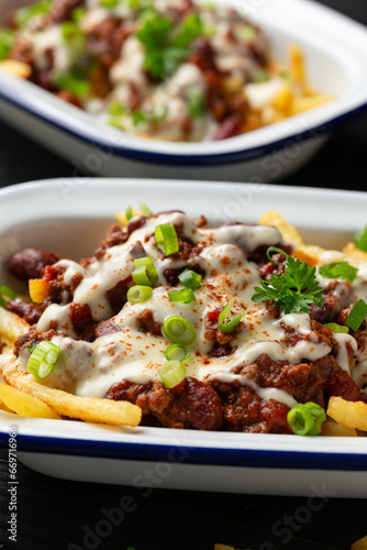Chili Cheese Potato Fries topped with hot minced beef and cheese sauce