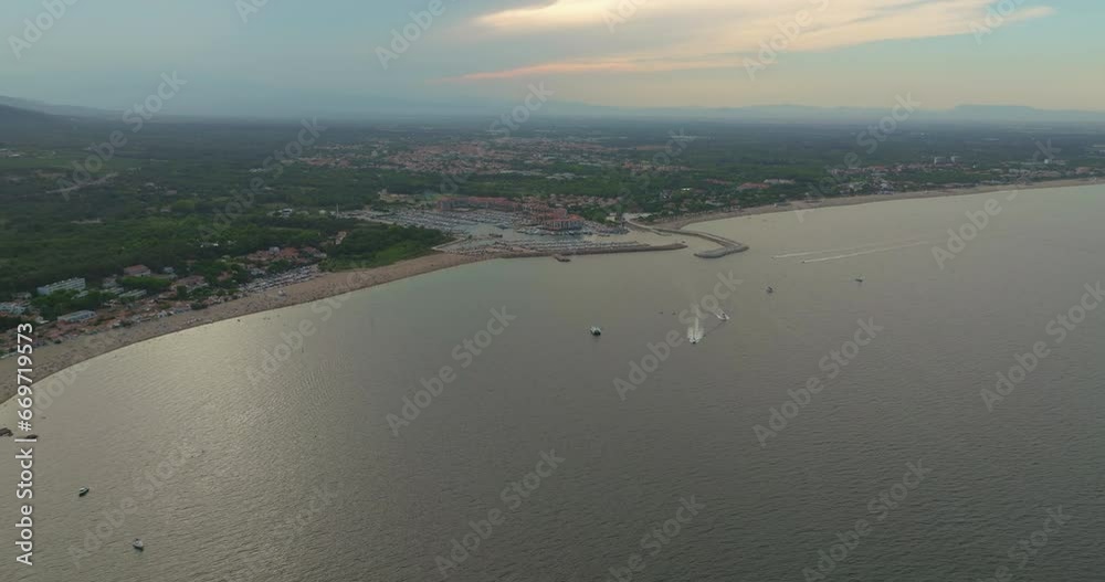Aerial view of a beach in city Argeles-sur-Mer near Collioure at the Mediterranean Sea during a hot summer day Aerial view of a beach in city Argeles-sur-Mer near Collioure at the Mediterranean Sea during a hot summer day